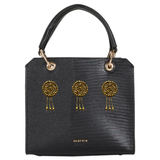 Drie maal de Op Naai Fashion Part Rond Met Drie Hangers op een zwarte tas