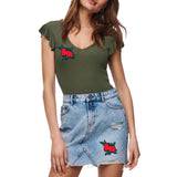 Twee maal de Roos Roosjes Strijk Embleem Patch op zowel een groen shirtje als op een spijkerrokje