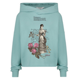 Vintage Lady Strijk Applicatie op een groen blauwe sweater