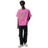 Pauw Peacock Full Color Strijk Applicatie op een roze t-shirt