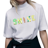 SHINE Tekst Strijk Applicatie op een wit t-shirt